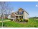 Inviting home with a two-car garage, charming front porch, and beautifully landscaped yard at 343 Brinkley Cir, Mebane, NC 27302