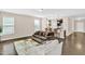 Living room view into kitchen provides an open concept feel with wood floors at 343 Brinkley Cir, Mebane, NC 27302