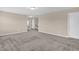 Spacious living room with neutral walls, plush carpet, and open layout at 343 Brinkley Cir, Mebane, NC 27302