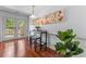 Cozy dining area with bar stools and natural light from french doors at 3743 Yorktown Pl, Raleigh, NC 27609
