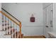 Welcoming entryway featuring a wooden staircase, coat rack, and hardwood floors at 3743 Yorktown Pl, Raleigh, NC 27609