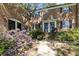 Brick facade townhouse featuring black shutters and lush landscaping at 3743 Yorktown Pl, Raleigh, NC 27609