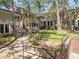 Charming brick townhome with landscaped front yard and inviting walkway to the front door at 3743 Yorktown Pl, Raleigh, NC 27609