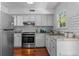 Modern kitchen featuring stainless steel appliances and subway tile backsplash at 3743 Yorktown Pl, Raleigh, NC 27609
