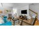 Bright open living area with sleek furniture and hardwood floors at 3743 Yorktown Pl, Raleigh, NC 27609