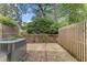 Backyard patio features a combination of gravel and cement flooring surrounded by privacy fences at 3743 Yorktown Pl, Raleigh, NC 27609