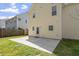 The backyard of the home, featuring a concrete patio area and siding at 3905 Joe And Ruth Lee Dr, Raleigh, NC 27610