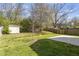 Large backyard area with a shed and a concrete slab for outdoor activities and entertainment at 3905 Joe And Ruth Lee Dr, Raleigh, NC 27610