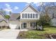 Two-story home with a front lawn, landscaping, an attached garage and covered entryway at 3905 Joe And Ruth Lee Dr, Raleigh, NC 27610