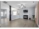 Spacious living room featuring a fireplace, ceiling fan, and plenty of natural light at 3905 Joe And Ruth Lee Dr, Raleigh, NC 27610