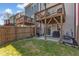 Townhome backyard featuring a wooden fence, patio area, and upper deck, perfect for entertaining guests at 404 Cotton Brook Dr, Fuquay Varina, NC 27526
