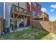 Townhome backyard featuring a wooden fence, patio area, and upper deck, ideal for outdoor living at 404 Cotton Brook Dr, Fuquay Varina, NC 27526