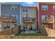 Townhome backyard featuring a wooden fence, patio area, and upper deck, great for outdoor entertaining at 404 Cotton Brook Dr, Fuquay Varina, NC 27526