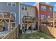 Townhome backyard featuring a wooden fence, patio area, and upper deck, perfect for relaxing outdoors at 404 Cotton Brook Dr, Fuquay Varina, NC 27526