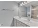 Bathroom features a double vanity, a large mirror, and a glass-enclosed shower at 404 Cotton Brook Dr, Fuquay Varina, NC 27526
