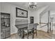 Dining room features a dark table with chairs, decorative art, and a coffee/wine bar at 404 Cotton Brook Dr, Fuquay Varina, NC 27526