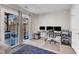 Bright home office with ample natural light, patio access and a modern desk setup for a productive workspace at 404 Cotton Brook Dr, Fuquay Varina, NC 27526
