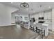 Kitchen adjacent to dining area features white cabinetry, stainless steel appliances, and an island with seating at 404 Cotton Brook Dr, Fuquay Varina, NC 27526
