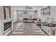 Bright living room with a modern fireplace, comfortable seating, and large windows for a welcoming space at 404 Cotton Brook Dr, Fuquay Varina, NC 27526