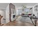 Inviting living room features a decorative fireplace, ceiling fan, and a plush gray sofa for comfortable living at 404 Cotton Brook Dr, Fuquay Varina, NC 27526