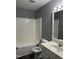 Full bathroom features tub/shower and vanity with sink at 4423 Sugarbend Way, Raleigh, NC 27606