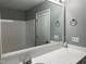 Bathroom vanity featuring sink, large mirror and combo tub and shower at 4423 Sugarbend Way, Raleigh, NC 27606