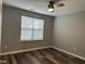 Cozy bedroom features modern ceiling fan and great natural light at 4423 Sugarbend Way, Raleigh, NC 27606