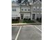 Street view of well maintained townhomes with dedicated parking spaces at 4423 Sugarbend Way, Raleigh, NC 27606