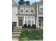 Charming townhome with a well-maintained front yard and inviting entryway at 4423 Sugarbend Way, Raleigh, NC 27606