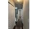 Hallway features wood-look flooring and white doors at 4423 Sugarbend Way, Raleigh, NC 27606