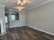 Open living room features luxury vinyl flooring and modern ceiling fan at 4423 Sugarbend Way, Raleigh, NC 27606