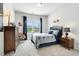 Bright bedroom with baseball-themed decor, a dresser, and a window with natural light at 49 Olivia Crossing Ct # 43, Four Oaks, NC 27524