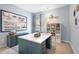 Bright craft room features a large workspace, pegboard, storage shelves, and ample drawers at 49 Olivia Crossing Ct # 43, Four Oaks, NC 27524