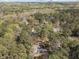 An aerial view of a neighborhood surrounded by lush green trees at 5120 Knaresborough Rd, Raleigh, NC 27612