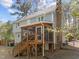 Exterior view of the home with a screened porch and brick chimney at 5120 Knaresborough Rd, Raleigh, NC 27612