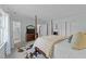 Light-filled bedroom with a four-poster bed and attached bathroom at 5120 Knaresborough Rd, Raleigh, NC 27612