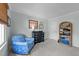 Relaxing bedroom with sitting chair, dresser, and neutral color scheme at 5120 Knaresborough Rd, Raleigh, NC 27612