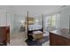 Charming bedroom showcasing a classic four-poster bed and cozy decor at 5120 Knaresborough Rd, Raleigh, NC 27612