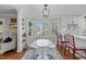 Charming breakfast nook featuring a round table, bay windows, and stylish decor at 5120 Knaresborough Rd, Raleigh, NC 27612