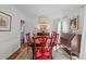 Formal dining room featuring a decorative chandelier, bright windows, and a sleek modern rug at 5120 Knaresborough Rd, Raleigh, NC 27612
