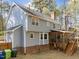 Exterior view of home showing back patio and a screened in back porch at 5120 Knaresborough Rd, Raleigh, NC 27612