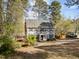 Charming two-story home with a well-manicured lawn and mature trees at 5120 Knaresborough Rd, Raleigh, NC 27612
