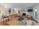 Cozy living room with brick fireplace, decorative mirrors, and stylish furnishings at 5120 Knaresborough Rd, Raleigh, NC 27612