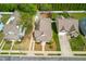 Aerial view of a well-maintained home with a landscaped yard and a charming front porch at 524 Beckwith Ave, Clayton, NC 27527