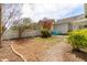 View of the backyard with a white fence, patio area, and a cozy seating arrangement at 524 Beckwith Ave, Clayton, NC 27527