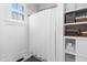 Bathroom with a shower with white tile and built-in shelving at 524 Beckwith Ave, Clayton, NC 27527