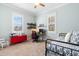 Bedroom featuring carpet floors, light-green walls, and two windows at 524 Beckwith Ave, Clayton, NC 27527