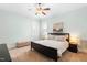 This bedroom features carpet floors, a ceiling fan, and light-green colored walls at 524 Beckwith Ave, Clayton, NC 27527