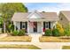 Charming one-story home with white siding, black shutters, and a welcoming front porch with American flag at 524 Beckwith Ave, Clayton, NC 27527