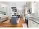 Open-concept kitchen with island and stainless appliances flows into dining and living areas at 524 Beckwith Ave, Clayton, NC 27527